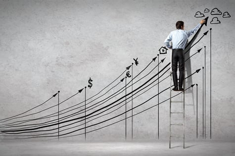 Back view image of businessman drawing graphics on wall Back view image of businessman drawing graphics on wall